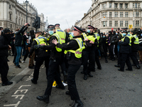 Police push protesters back in London, Britain, 3 April 2021. Protests around the United Kingdom have been held in opposition to the Police,...