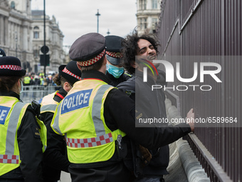 LONDON, UNITED KINGDOM - APRIL 03, 2021: Police officers arrest a demonstrator in Parliament Square after a protest against government’s Pol...