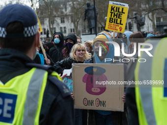 LONDON, UNITED KINGDOM - APRIL 03, 2021: Demonstrators stand behind a police cordon in Parliament Square after a protest against government’...