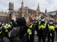 LONDON, UNITED KINGDOM - APRIL 03, 2021: Police clash with demonstrators in Parliament Square after a protest against government’s Police, C...
