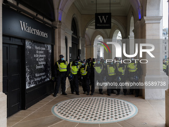 LONDON, UNITED KINGDOM - APRIL 03, 2021: Police officers cordon off demonstrators in central London after a protest against government’s Pol...