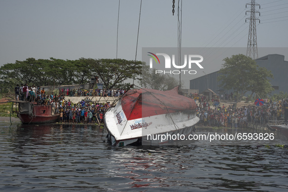 A rescue ship pulling out the capsized boat from the Shitalakshya River, in Narayanganj on April 5, 2021. 
