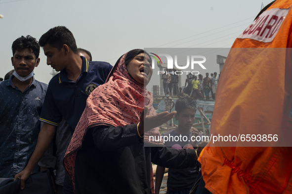 A woman burst into tears while looking for the dead body of her relatives who got killed in the boat crush at Shitalakshya River, in Narayan...
