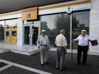 Pensioners outside a closed Piraeus Bank in Athens on June 29, 2015. Greece weighed drastic banking restrictions to stave off a financial co...