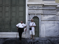 Pensioners outside the closed National Bank of Greece headquarters in Athens on June 29, 2015. Greece weighed drastic banking restrictions t...