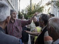 Pensioners outside the closed National Bank of Greece headquarters in Athens on June 29, 2015. Greece weighed drastic banking restrictions t...
