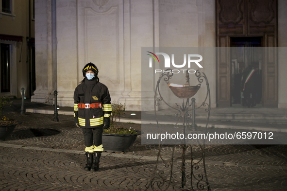 Portrait of a firefighter near the torch in L'Aquila on 6 April 2021 during the 12th anniversary of the 2009 LAquila earthquake. On each ann...