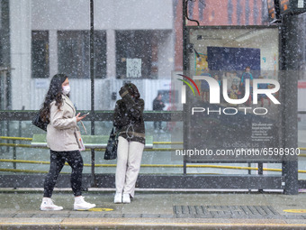 A snow storm hits New Islington Marina in Manchester city centre, UK, just days after the temperature reached 21C, on 6th April 2021. (