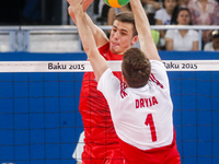 Dawid DRYJA (1) of Poland is jumping on the net on the hit of Ilia VLASOV (2) of Russia  in the match Poland - Russia during the final for b...