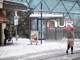 Daily life scenes in Eindhoven city center during the snow. The third day of the unusual April snowfall in The Netherlands, the country wake...