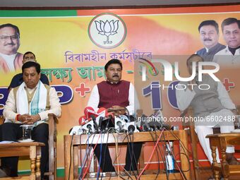 Assam Chief Minister Sarbananda Sonowal alongwith  BJP leader Himanta Biswa Sarma and Ranjit Kumar Das during a party press conference at BJ...