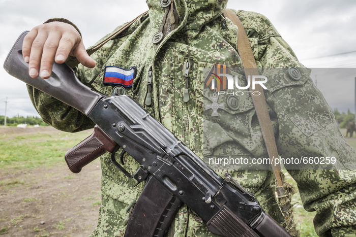 Volunteer with a medal of a battalion of the DPR army during a military training in the outskirts of Donetsk city on June 29, 2015. (Photo b...