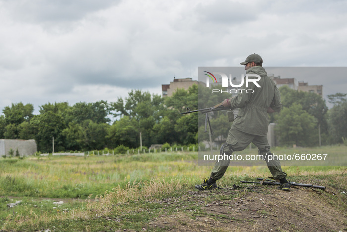 Soldier shooting with a machine gun during a military training of the DPR army in the outskirts of Donetsk city on June 29, 2015. (Photo by...