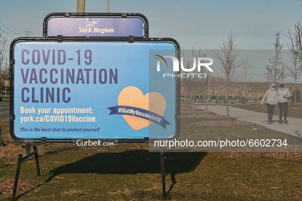 COVID-19 vaccination centre sign outside the Aaniin Community Centre in Markham, Ontario, Canada on April 07, 2021. To combat the spread of...