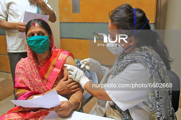 A beneficiary receives a dose of COVID-19 vaccine, at a camp  in Jaipur,Rajasthan, India, Thursday, April 8, 2021.