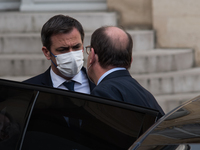 Health Minister Olivier Veran exchanges a few words with Prime Minister Jean Castex at the end of the Council of Ministers held at the Elysé...