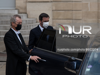 French Health Minister Olivier Veran barely looks at journalists at the end of the Council of Ministers meeting at the Elysée Palace, in Par...