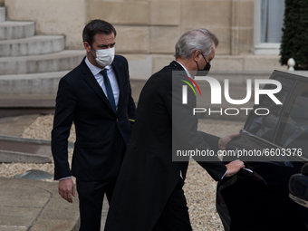 French Health Minister Olivier Veran barely looks at journalists at the end of the Council of Ministers meeting at the Elysée Palace, in Par...