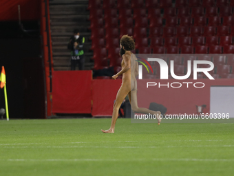 A naked man known as Olmo Garcia jumps into the field during the UEFA Europa League Quarter Final leg one match between Granada CF and Manch...