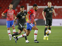 Yangel Herrera, of Granada CF  and Bruno Fernandes, of Manchester United during the UEFA Europa League Quarter Final leg one match between G...