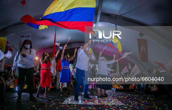  Presidential Candidate of Union por la Esperanza Andres Arauz waves an Ecuadoran flag while running on stage during the closing event of hi...