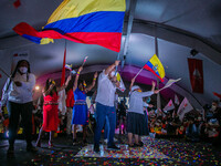  Presidential Candidate of Union por la Esperanza Andres Arauz waves an Ecuadoran flag while running on stage during the closing event of hi...