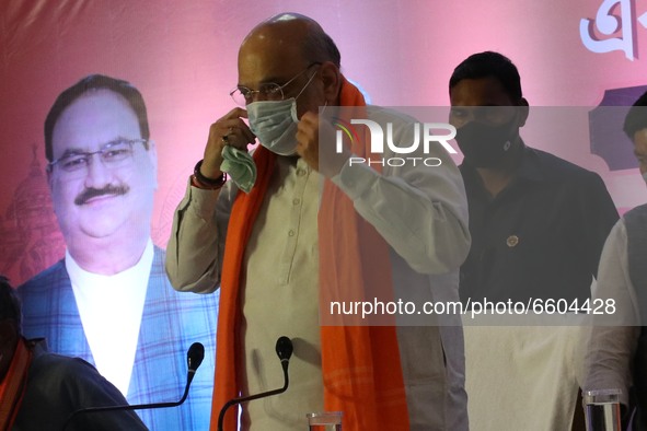 Union Home Minister and Senior BJP Leader Amith Shah warring protective face mask  meet the press ahead West Bengal Assembly polls on April...