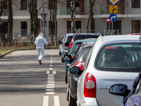 Cars wait in a queue to the PCR Coronavirus drive thru testing site at Touron Arena on April 9, 2021 in Krakow, Poland. Number of Covid-19 c...