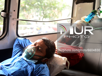 A Covid-19 patient wait inside an ambulance in front of Dhaka Medical College Hospital for treatment in Dhaka, Bangladesh, on April 09, 2021...