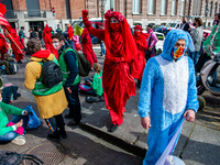 The Red Rebels are walking through the activists, during the  massive disruptive action carried out by Extinction Rebellion, on April 9th in...