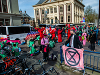 The Red Rebels are walking through the activists, during the  massive disruptive action carried out by Extinction Rebellion, on April 9th in...