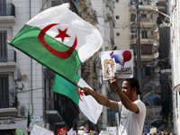 Algerians shout anti French slogans during an anti-government demonstration in the capital Algiers on April 9, 2021 (