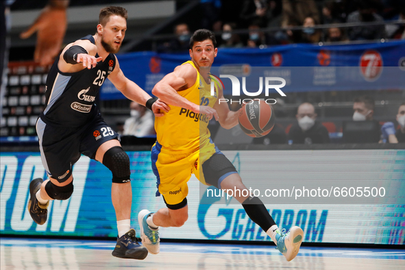 Mateusz Ponitka (L) of Zenit St Petersburg and John Dibartolomeo of Maccabi Playtika Tel Aviv in action during the EuroLeague Basketball mat...