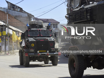 Indian forces leave from a gun battle site in Shopian district of Indian Administered Kashmir on 09 April 2021. Seven militants were killed...