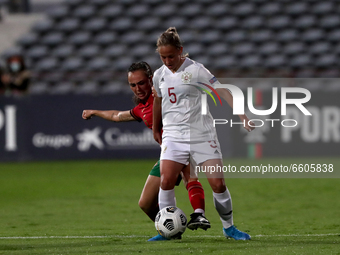 Yana Sheina of Russia (R ) vies with Joana Marchao of Portugal during the UEFA Women's EURO 2022 play-off first leg match between Portugal a...