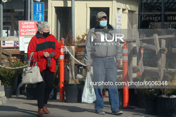 People wearing face masks to protect them from the novel coronavirus (COVID-19) in Markham, Ontario, Canada on April 09, 2021. Ontario is re...