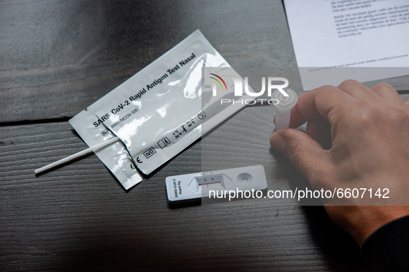 A man is waiting for the result of his Corona rapid self-test that from today people can purchase in several drugstore chains in The Netherl...