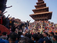 Devotees pull a chariot carrying an idol of Hindu god Bhairav during the Bisket Jatra festival held to mark the Nepalese New Year in Bhaktap...