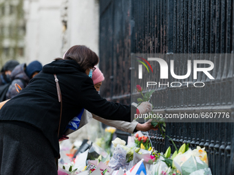 Members of the public leave a floral tributes to Prince Philip, Duke Of Edinburgh outside Buckingham Palace in London, Britain, 10 April 202...