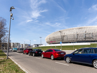 Cars wait in a queue to the PCR Coronavirus drive thru testing site at Touron Arena on April 10, 2021 in Krakow, Poland. Number of Covid-19...