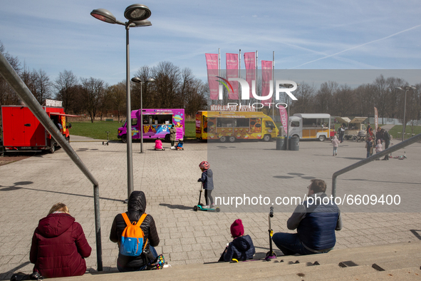Families enjoy sunny, warm day after particularly cold period amid the third wave of Coronavirus pandemic in a public park in Krakow, Poland...