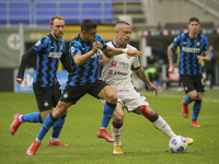 Alexis Sanchez (L) of FC Internazionale competes for the ball with Radja Nainggolan (R) of Cagliari Calcio during the Serie A match between...