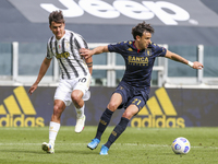 Paulo Dybala of Juventus FC and Ivan Radovanovic of Genoa CFC during the Serie A football match between Juventus FC and Genoa CFC at Allianz...