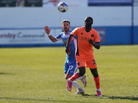 Gime Toure of Carlisle United in action with Bradley Barry of Barrow   during the Sky Bet League 2 match between Barrow and Carlisle United...