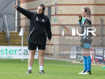 L-R Sadie Blakely - Manager of Chichester and Selsey Ladies FC final Instructions to Issy Foster of Chichester and Selsey Ladies FC  during...