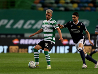 Pedro Goncalves of Sporting CP (L) vies with Pepe Rodrigues of FC Famalicao during the Portuguese League football match between Sporting CP...