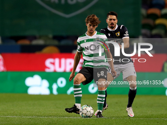 Daniel Braganca of Sporting CP (L) vies with Gil Dias of FC Famalicao during the Portuguese League football match between Sporting CP and FC...