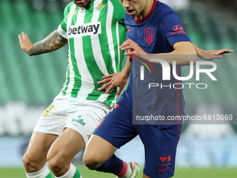 Aitor Ruibal of Real Betis Balompie in action with Joao Felix of Atletico de Madrid during the La Liga Santander match between Real Betis an...