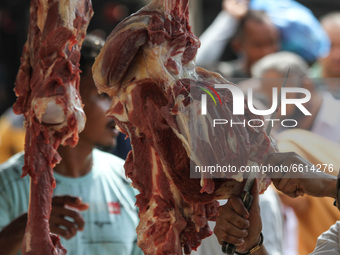 Acehnese are seen crowded into traditional markets to buy meat, as a tradition of welcoming the month of Ramadan called 