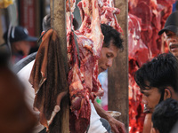 Acehnese are seen crowded into traditional markets to buy meat, as a tradition of welcoming the month of Ramadan called 